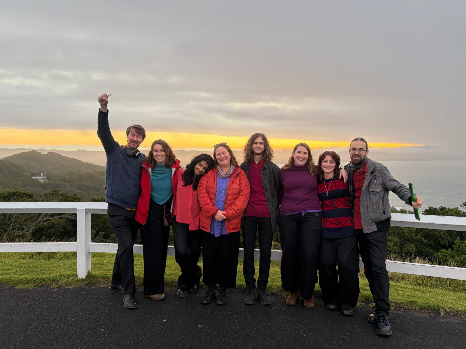The tour group together at sunset