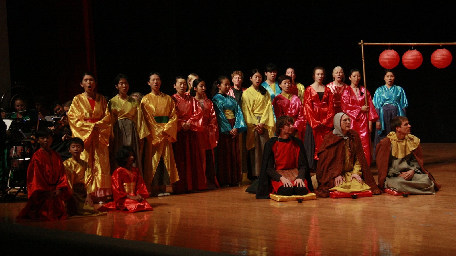 Wayfarers performing music-theatre on stage